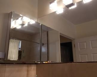 Mirrored medicine cabinet; vanity lights