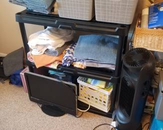 Plastic shelving; monitor; household supplies