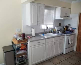 Cute white kitchen with nice cabinets