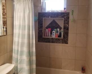 Shower curtain; curved shower rod