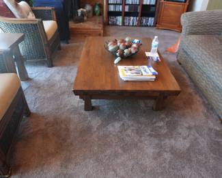 Solid wood plank-style coffee table. Thick block legs.