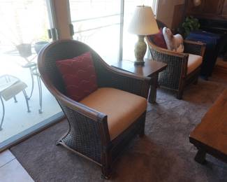 Woven Rattan Accent Chairs (Pair). Barrel-back. Tan cushions. Accent pillows included.