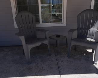 Pair of gray plastic/resin patio chairs with matching square side table
