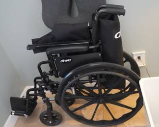Drive medical wheelchair. Includes padded seat cushion.