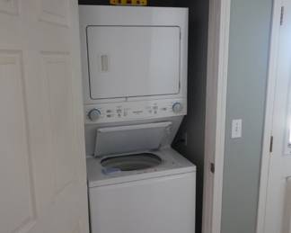 Stacked washer/dryer unit combo. Closet-fit apartment size