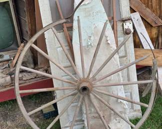Salvage pieces: wood buggy wheel, wood ironing board and crackle paint vintage door
