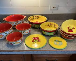 Tara pottery….two sets. One fall bowl set of 4. Hot plates and a salad bowl set