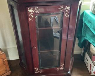 Antique Rosewood curio cabinet with insets. Glass shelves inside.