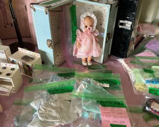 Doll and clothes plus suitcase