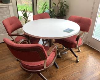Classic kitchen set with chairs upholstered from Geneva a shop. Chairs swivel and are on castors