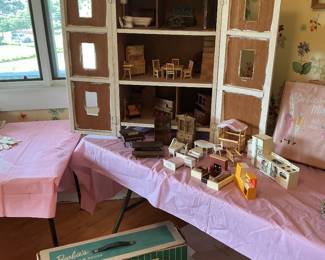 Full doll house with a variety of furniture including Fisher price sets