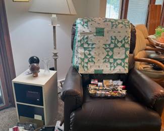 Recliner, Quilts, Floor Lamp, White Side Table 