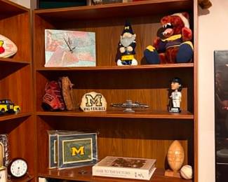 University of Michigan Memorabilia & Collectibles Featuring U of M collectibles, vintage clocks, books, die-cast vehicles, sports memorabilia, and more throughout the home.