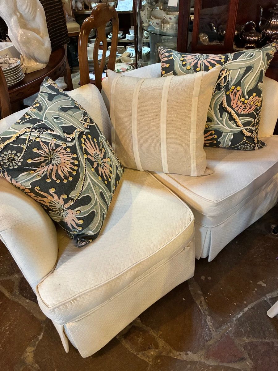 Love seat that converts into 2 corner chairs. $150 clearance. pillows are separate