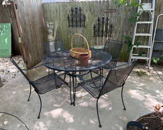 Wrought iron patio table with 4 chairs