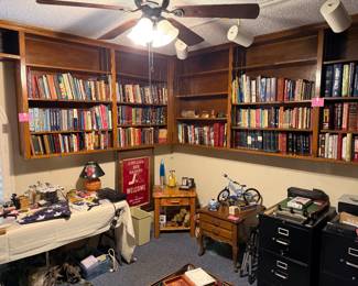 Lots of bibles and books, file cabinets, cameras, puzzles and more in the office!