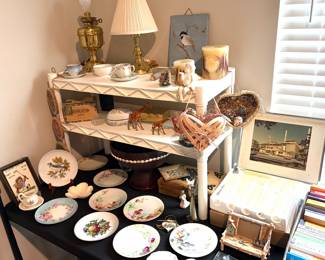 Collection of vintage plates, brass lamps and other home decor 