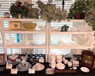 Vintage China places settings, vintage milk glass and a mantle clock.