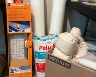 Fiskars Rotary Cutter and Ruler Combo plus a a bag of Fairfield Poly-Fil and scrap fabric