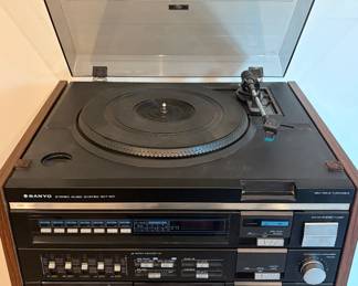 vintage Sanyo GXT-212 stereo music system features a turntable, dual cassette deck, and AM/FM radio.