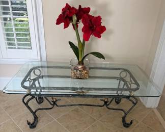 Metal Coffee Table With Tempered Glass Top and Gold Toned Accent And Floral Arrangement