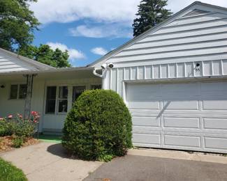 Enter through garage door on right