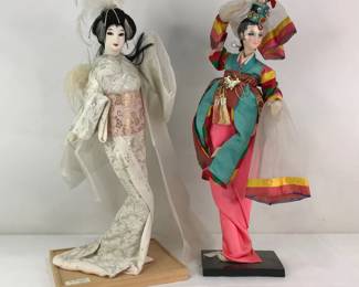 Vintage Korean and Japanese Dolls on Wooden Platforms