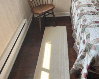 Three white throw rugs