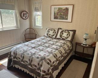 Full-size bed with pillows and quilt