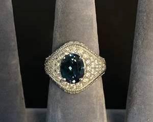 Judith Ripka Sterling Silver Ring with Oval Blue Gemstone and CZ Detailing