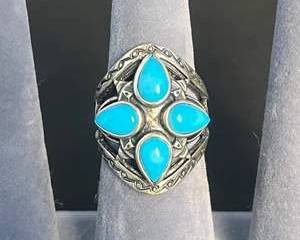 Silver Ring with Four TeardropShaped Turquoise Colored Stones
