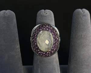 Sterling Silver Ring with Oval Moonstone and Purple Colored Gemstones