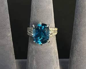 Sterling Silver Ring with a Blue Maybe Topaz Colored Stone and Accent Gems