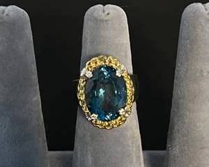 Sterling Silver Ring with Deep Blue Oval Gemstone and Yellow Accent Stones