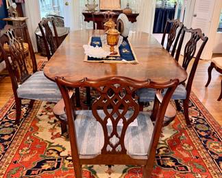 Antique Sheraton style double pedestal flame mahogany dining table; antique Chippendale chairs