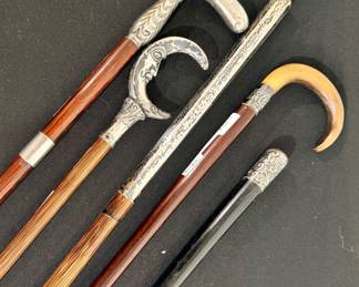 Walking sticks with sterling silver handles and ornamentation