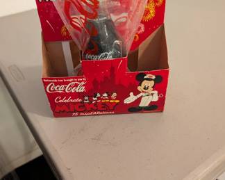 Limited edition Coca-Cola bottle celebrating Mickey Mouse's 75th anniversary with "inspEARations" designs