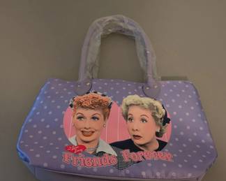 I love Lucy tote bag feauring a light blue polka do pattern with a graphic of Lucy and Ethel