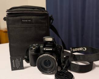 Canon powershot bridge camera with branded black carrying bag