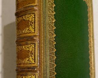 BEAUTIFULLY BOUND "WEBSTER'S DICTIONARY" IN GREEN LEATHER AND GOLD FILLIGREE.