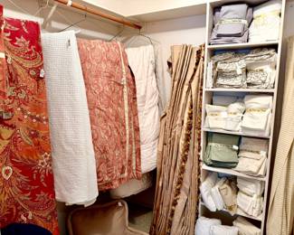 LINEN CLOSET WITH MANY SPREAD AROUND.