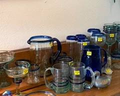 Amazing hand blown pieces with blue rims. Would look fabulous filled with frozen drinks on those hot summer days!