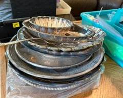 Many silver plated pieces.  A few unique bowls with red enamel insides.