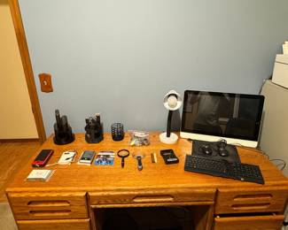 Assorted Desk Items: Calculators, Lamps, Digital Camera, Smart Watch, and Desk Accessories