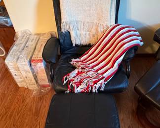 Black Leather Swivel Recliner with Ottoman and Throws