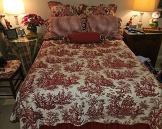 Beautiful Queen bed with red and white Toile bed spread with matching pillows