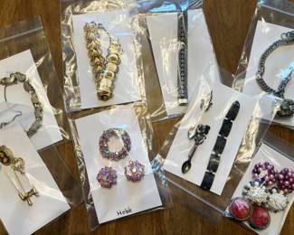 Table full of costume jewelry from 2 different estates