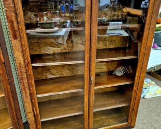 Glass double door book case with adjustable shelves