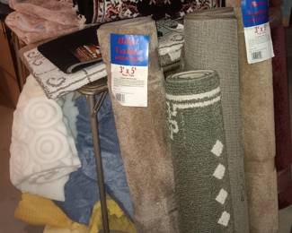 several new throw & area rugs