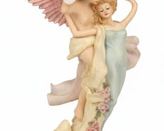 Figurines and Collectibles Display Featuring Pegasus, Carousel Horses, and Angels